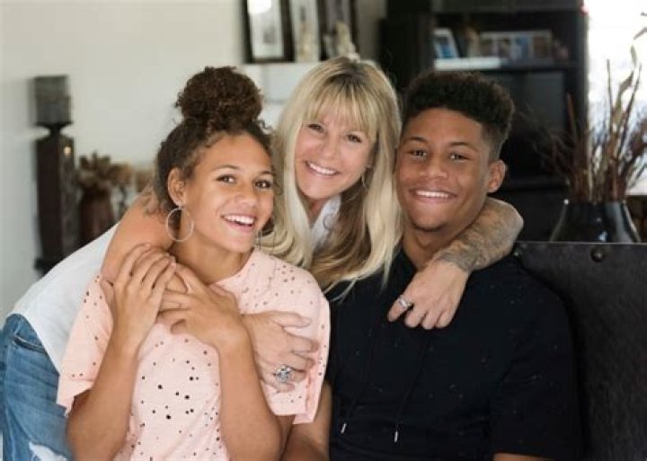 What does Dennis Rodman's ex-wife do for a living?