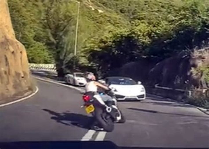 Female Biker Smashes Into Lamborghini in Hong Kong Check Motorcyclist Accident Dash Cam Video Clip