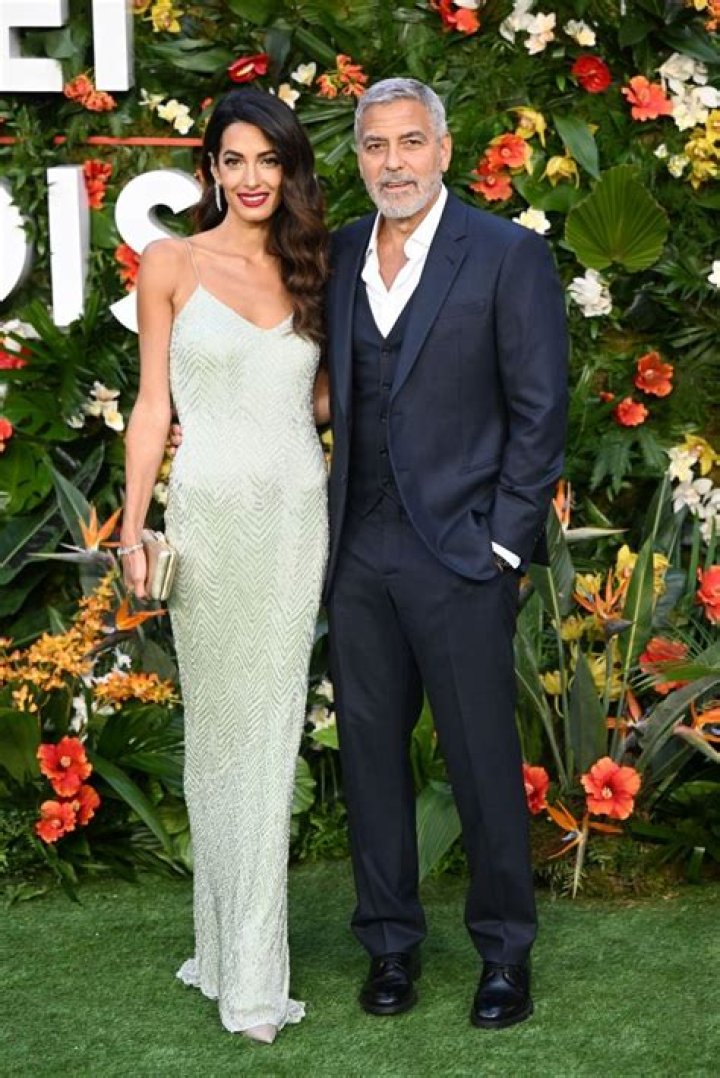 
George and Amal Clooney Are a Glamorous Pair at ‘Ticket to Paradise’ Red Carpet Premiere 